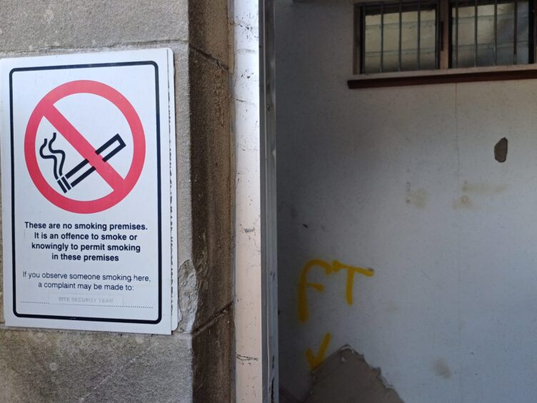 A no-smoking sign on the building