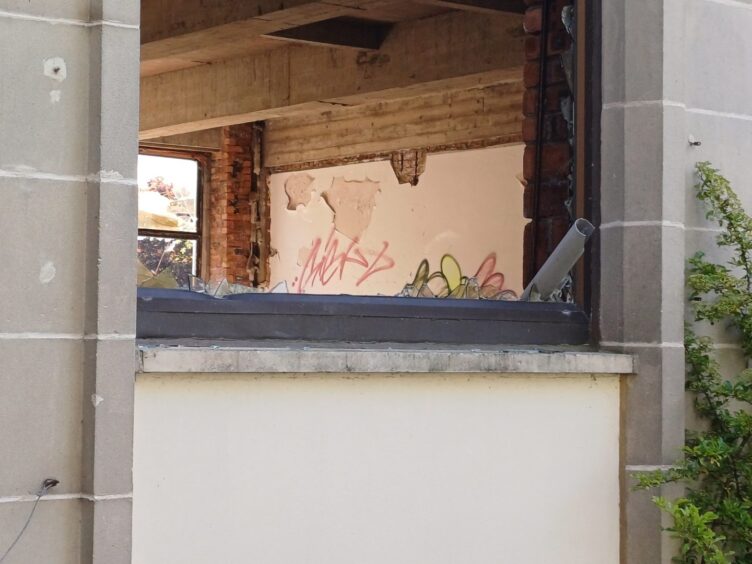 Graffiti daubed on interior walls