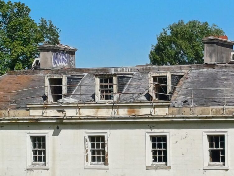 The building's damaged roof area