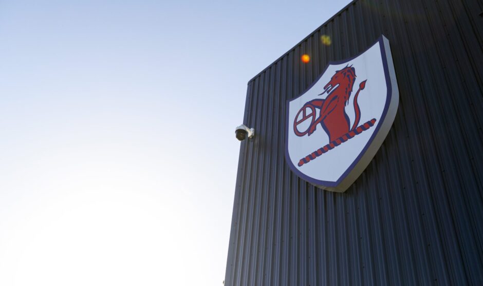 The Raith Rovers badge is pictured on the cladding of the main stand at Stark's Park.