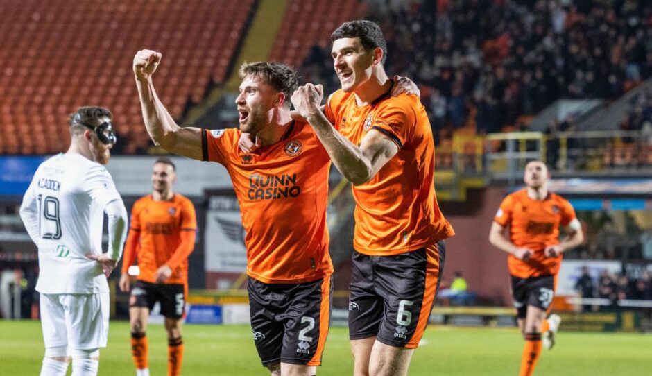 Ryan Strain, left, and Ross Graham celebrate the latter's goal when Dundee United and Hibs met at Tannadice.