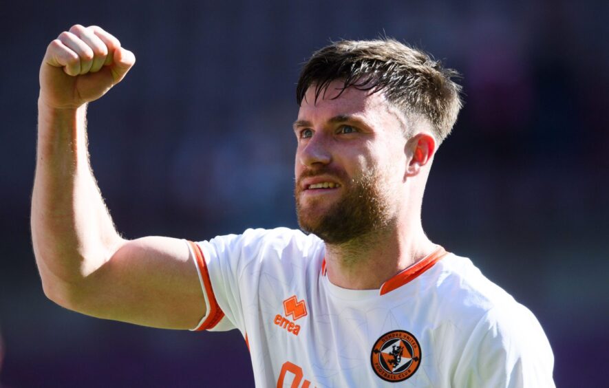 Dundee United's Ryan Strain celebrates a win over Hearts at Tynecastle