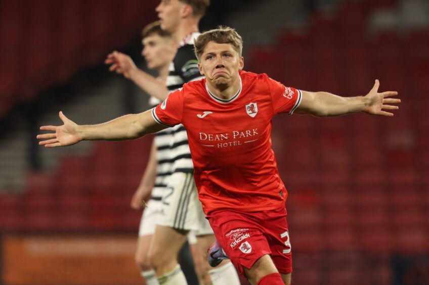 Aiden Marsh runs away with his arms outstretched as he celebrates Raith Rovers' fifth goal against Queen's Park.