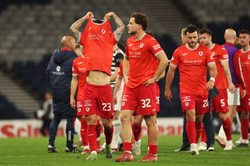 Raith Rovers players look dejected after missing out on a play-off spot.