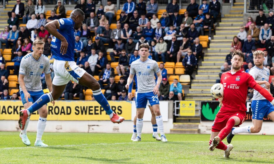 Uche Ikpeazu has a shot saved by Kieran O'Hara.