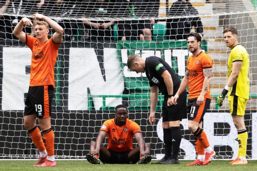 Emmanuel Adegboyega, pictured on the turf, was withdrawn against Hibs