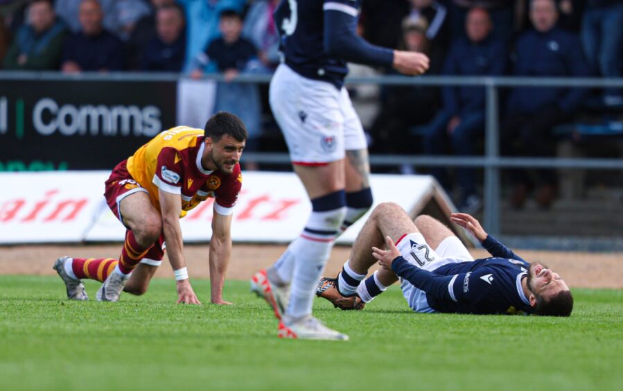 Motherwell's John Koutroumbis saw red after fouling Ziyad Larkeche. Image: Craig Foy/SNS