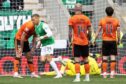 Hibenrian's Dwight Gayle wheels away after making it 3-1 against Dundee United