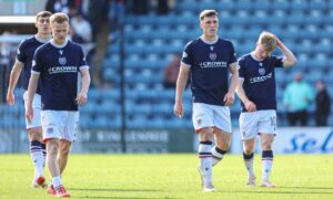Dundee players trudge off after another late Dens Park defeat. Image: Craig Foy/SNS