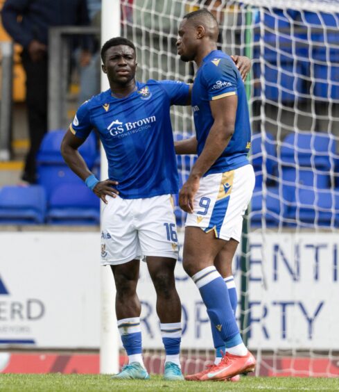Uche Ikpeazu with Adama Sidibeh at full-time.