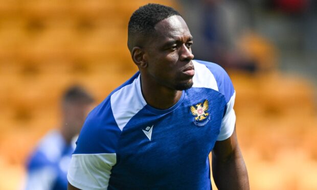 Uche Ikpeazu warms up before St Johnstone play Ross County.