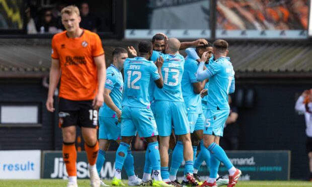 The delirious Buddies celebrate as Sam Dalby cuts a dejected figure