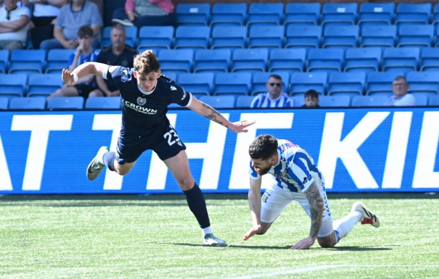Dundee attacker Seb Palmer-Houlden bundles over Liam Donnelly to gift Kilmarnock a first-half penalty.