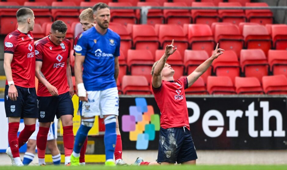 Barry Douglas watches on as Alex Samuel celebrates Ross County's equaliser. 