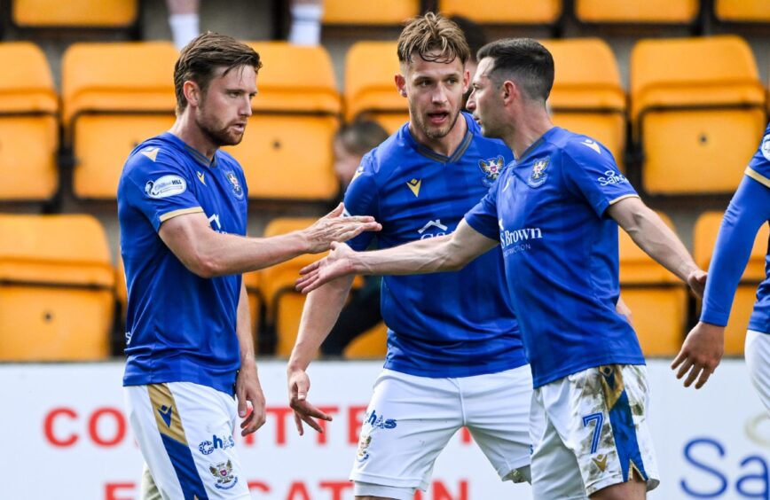 Elliot Watt is congratulated by his team-mates after scoring against Ross County.