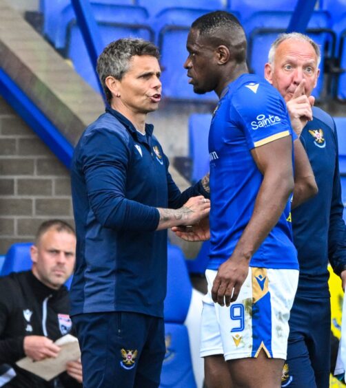 Simo Valakari shakes Uche Ikpeazu's hand after taking him off in the Ross County game.