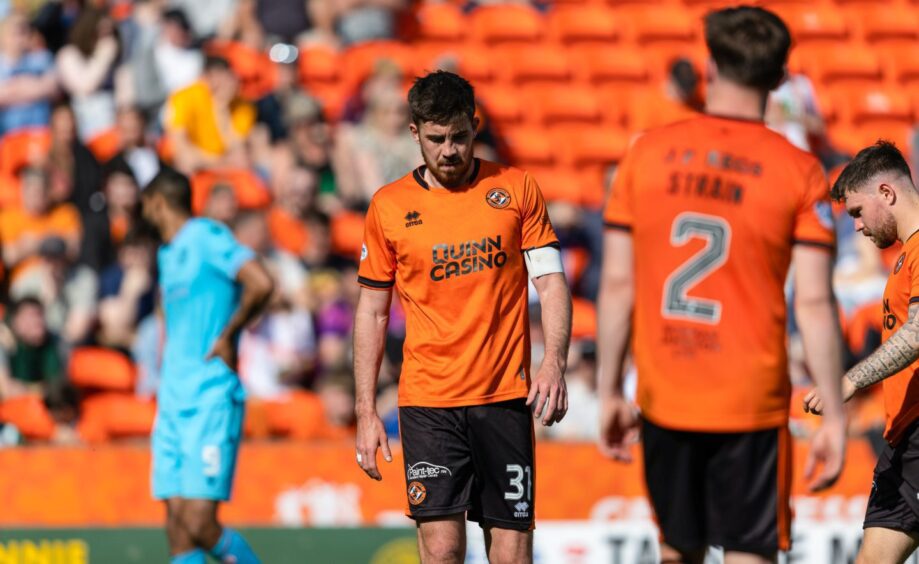 A dejected Declan Gallagher trudges forward