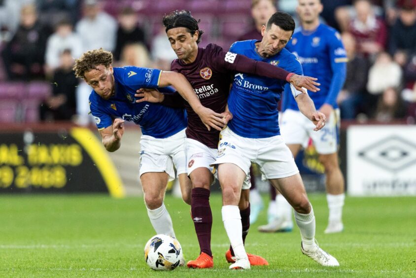 Jason Holt tackles Yan Dhanda.