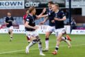 Dundee celebrate Scott Tiffoney's opening goal against Ross County on Wednesday. Image: Ross Parker/SNS