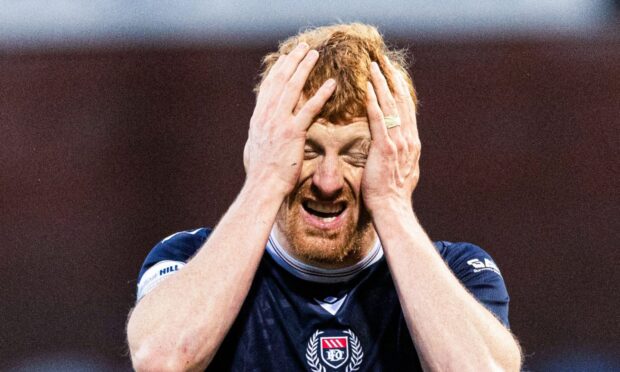 Simon Murray can't believe the penalty decision that denied Dundee victory as VAR failed to over-rule. Image: Ross Parker/SNS