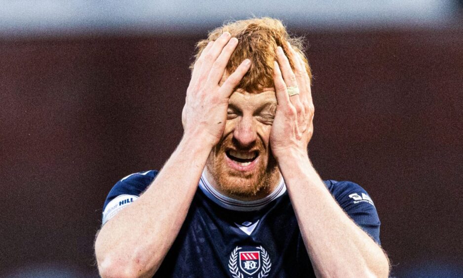 Simon Murray can't believe the penalty decision that denied Dundee victory as VAR failed to over-rule. Image: Ross Parker/SNS