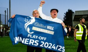East Fife manager Dick Campbell and twin brother and assistant Ian with the play-off winners banner.