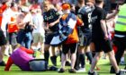 Jack Mackenzie hits the turf after being struck.