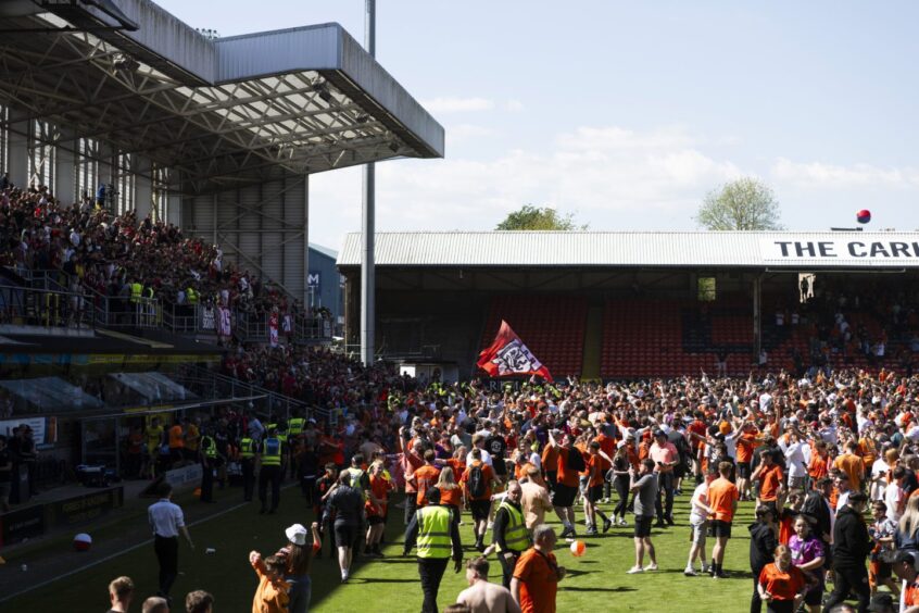 The Dundee United players were not permitted to return to the field for a lap of honour following the pitch invasion