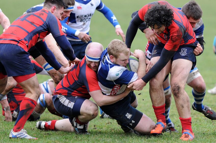 A tackle is made during a game between Howe of Fife and Musselburgh at Duffus Park