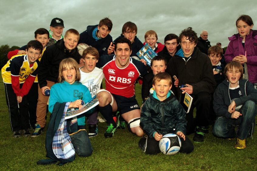Kelly Brown with a group of local kids. 