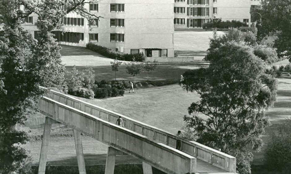 Image shows: a black and white photograph of The bridge over the loch at Stirling University. 