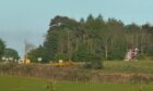 Helicopter called to Lundie Crags