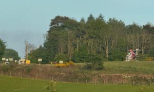 Helicopter called to Lundie Crags