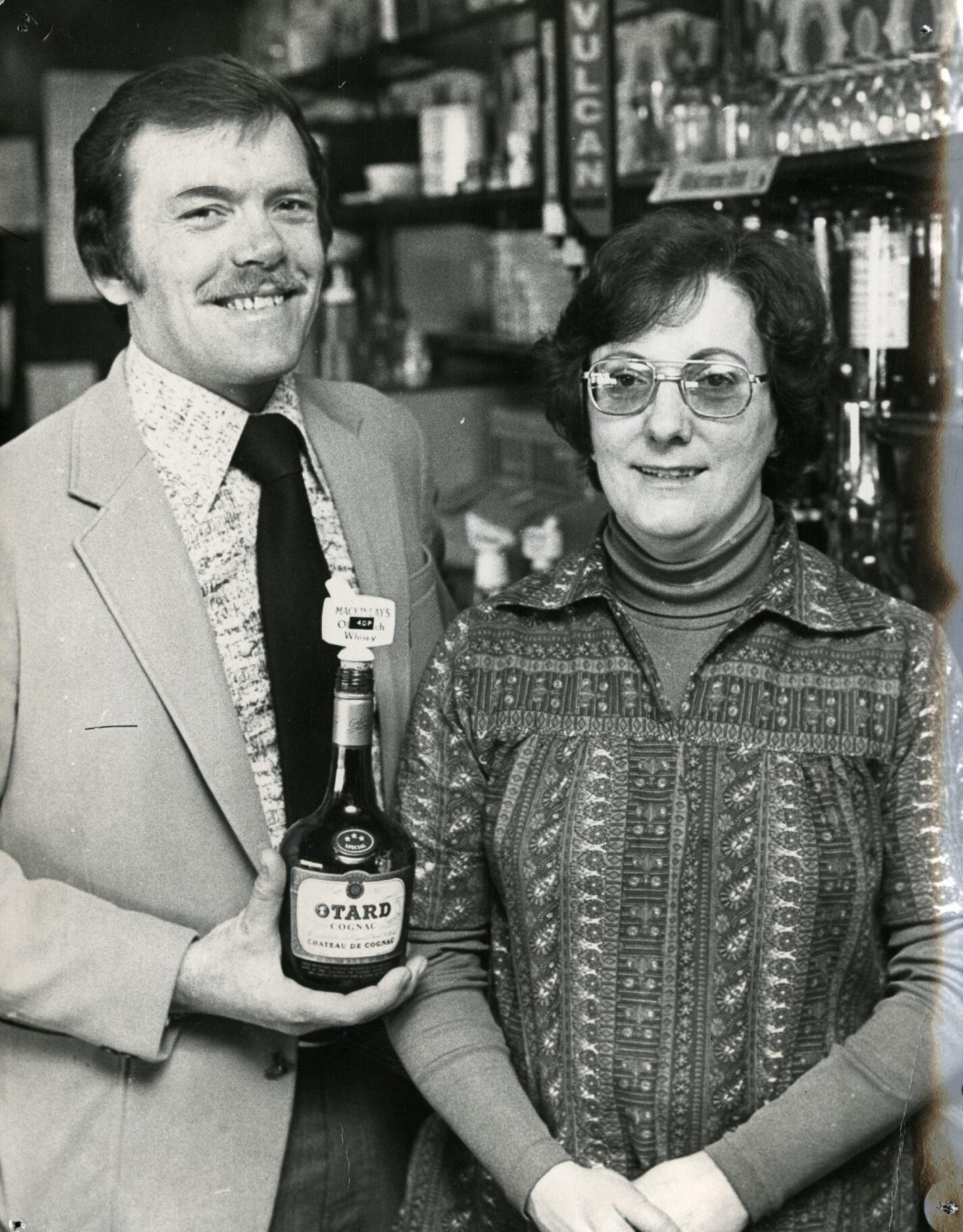 smiling Bill and Zena Wallace in March 1978, pictured behind the bar
