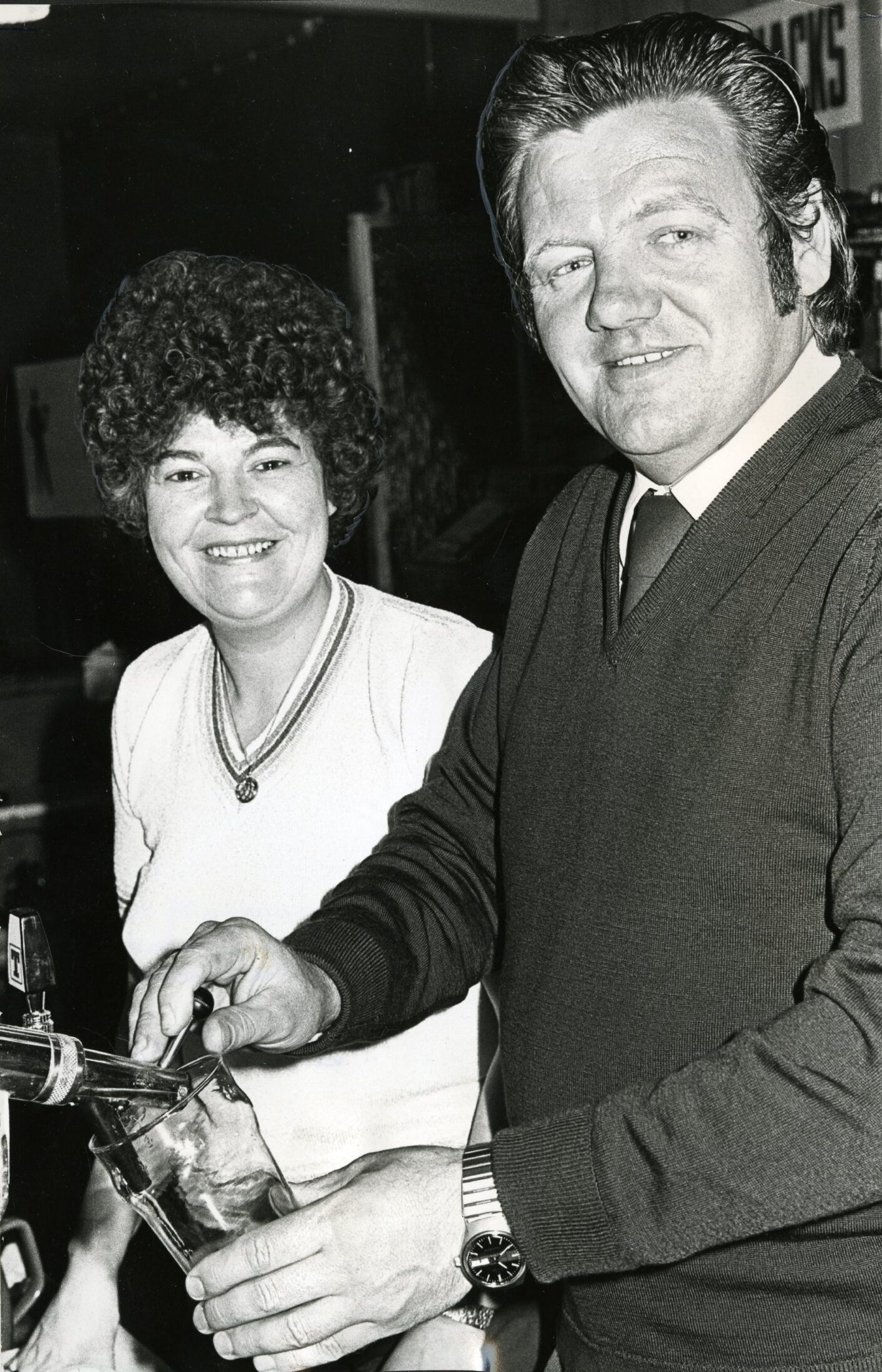John Conacher, who is pouring a pint, with his wife Irene 