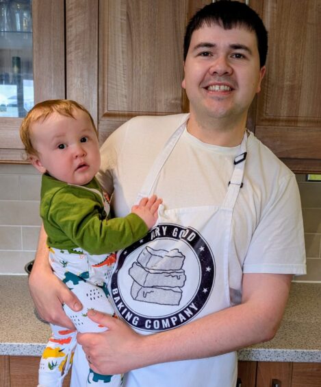 Aaron with youngest member of Very Good Bakery team, baby son Logan.