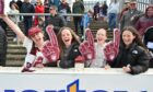 Arbroath fans cheer on their team. Pictures by Dave Johnston