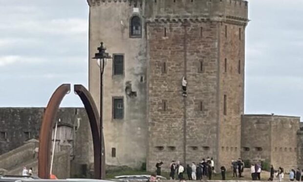 The youth was pictured climbing the walls of Broughty Castle. Image: Broughty Ferry Facebook group