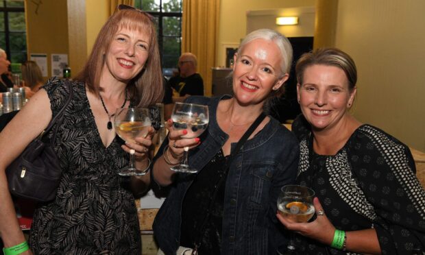Friends enjoy the night at Dunfermline Gin Festival 2025. Image: David Wardle