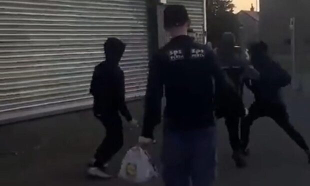 A still from the video of the fight on Craigowan Road in Charleston, Dundee. Image: Reddit