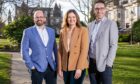 Company directors Craig Hutcheon, Claire Clark and Adam Maitland smile as they celebrate Hutcheon Mearns' anniversary