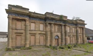 The derelict Watts of Cupar building is boarded up.
