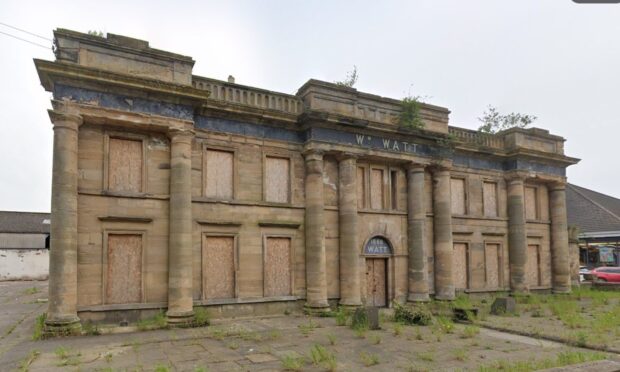 The derelict Watts of Cupar building is boarded up.