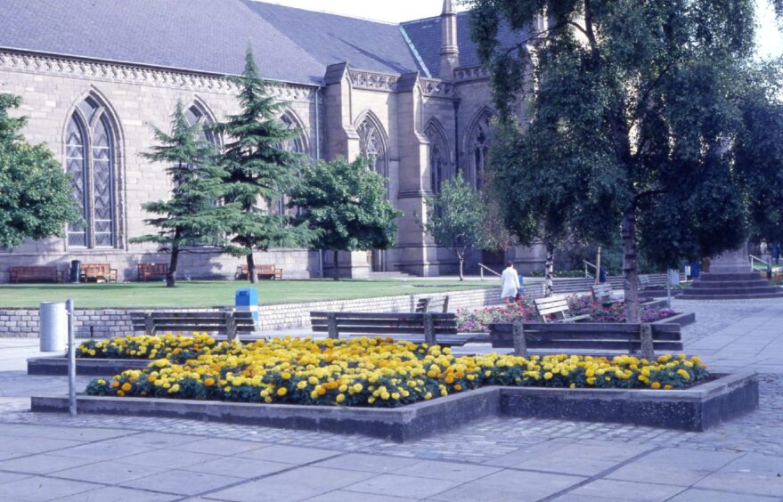 Flower beds in front of a large Dundee church in 1987