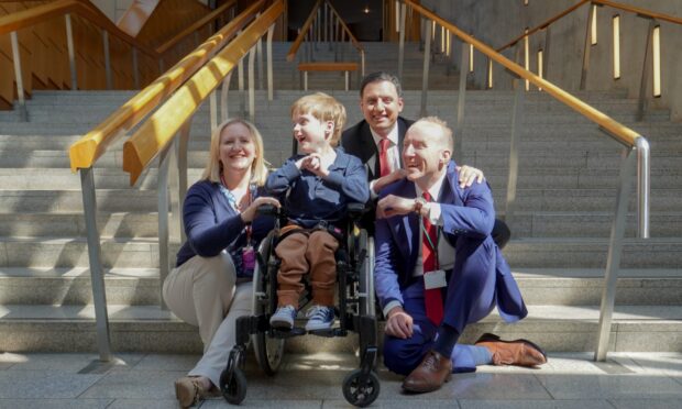 Dundee mum Nicola Donnelly with her son Leo, Michael Marra (right) and Scottish Labour leader Anas Sarwar. Image: Supplied.