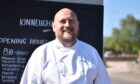 Chef James Ferguson smiling while standing outside.