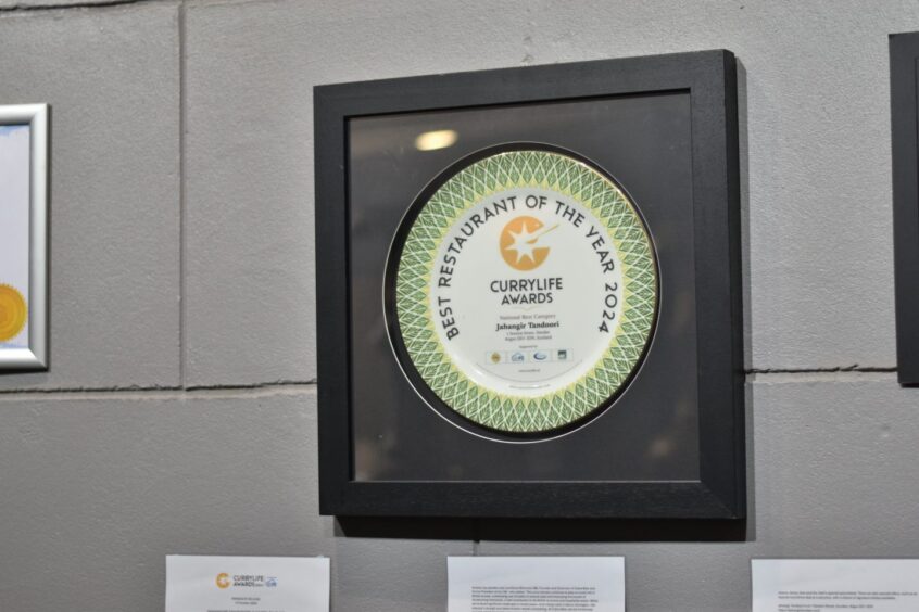 An award hanging on a restaurant wall.