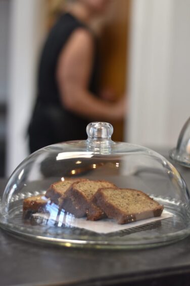 Slices of banana bread sitting inside a glass dish.