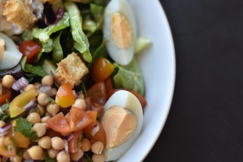 A close-up image of a bowl of salad.