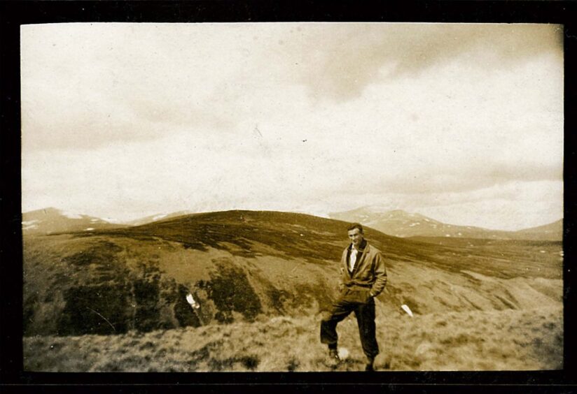 image shows: a black and white photograph of Bob Anderson in the Angus hills. He is the father of Sue Lawrence.